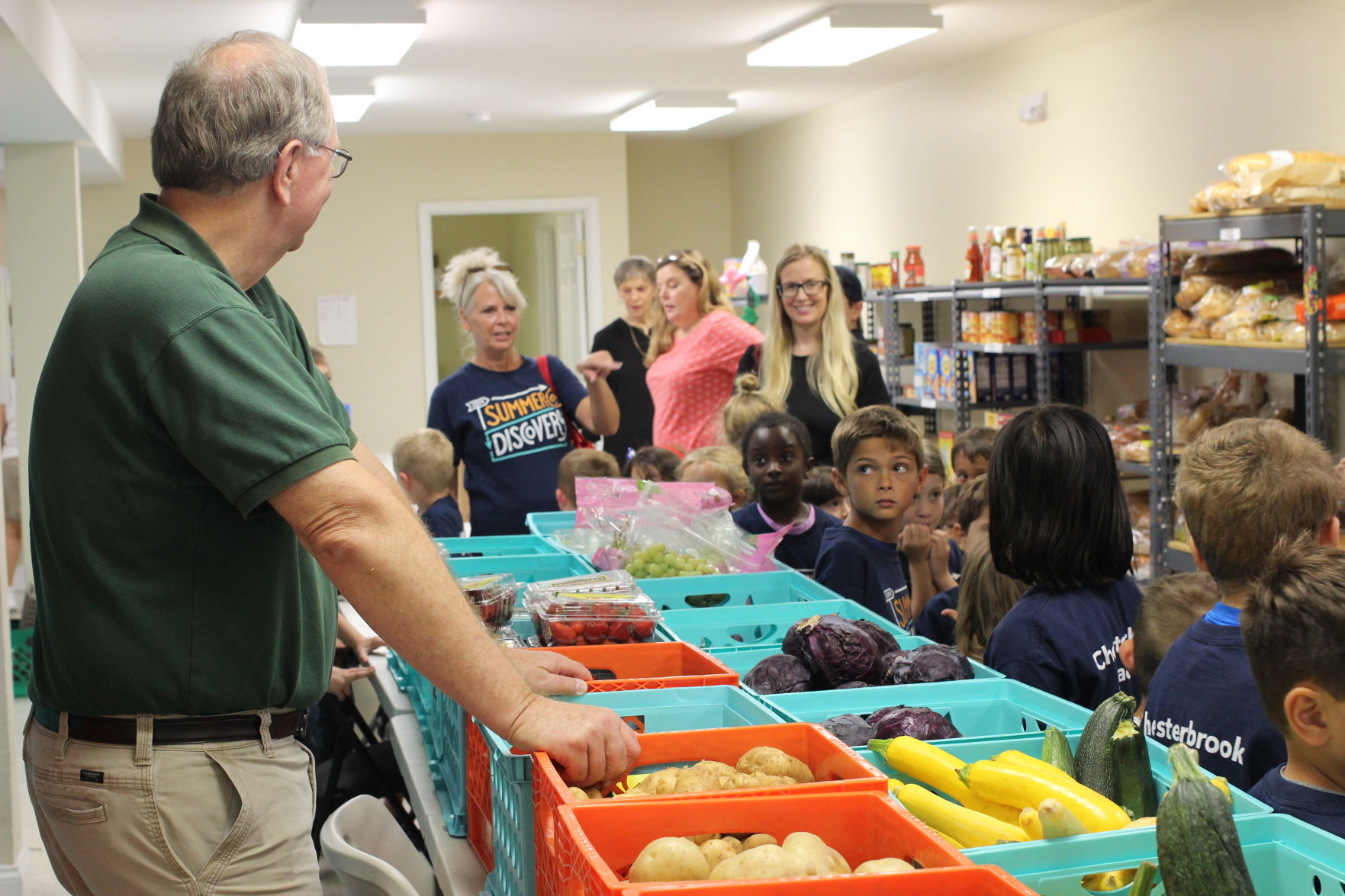 Chesterbrook Academy preschool students deliver food to the Haymarket food bank
